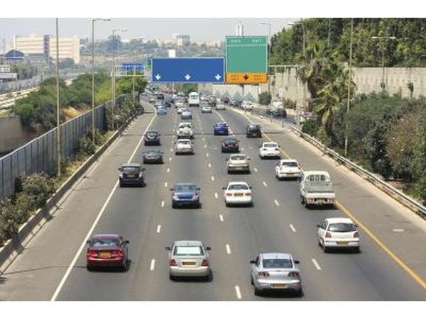A wide shot of cars driving on a freeway