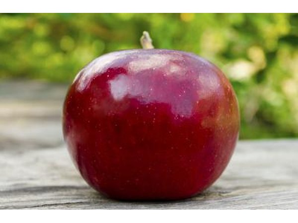 Close up of a ripe, red apple on a table