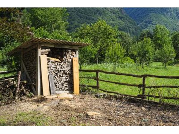 A small stand alone firewood shed.