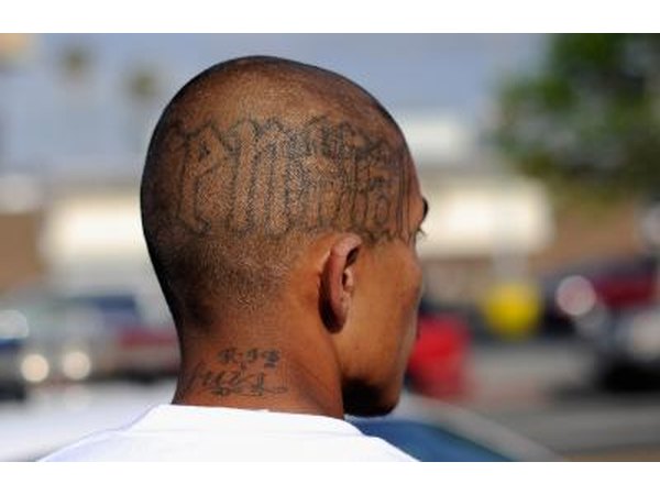 Gang member looking outward at street view