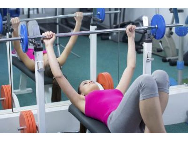 A woman is strength training.