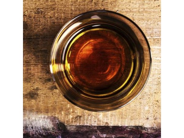 Top view of a shot of whiskey on counter