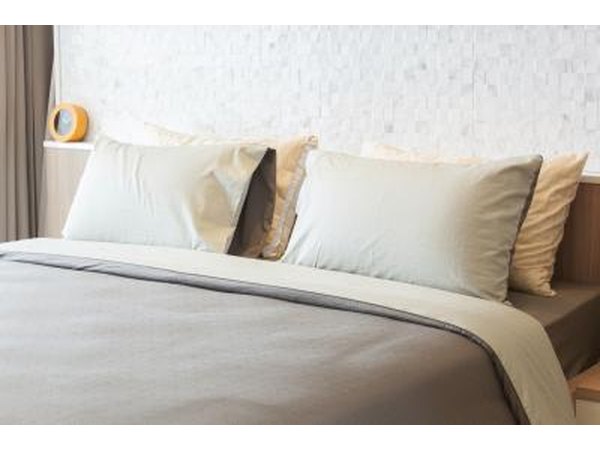 Choose a bedspread that reaches the floor to avoid the need for a bedspread.
