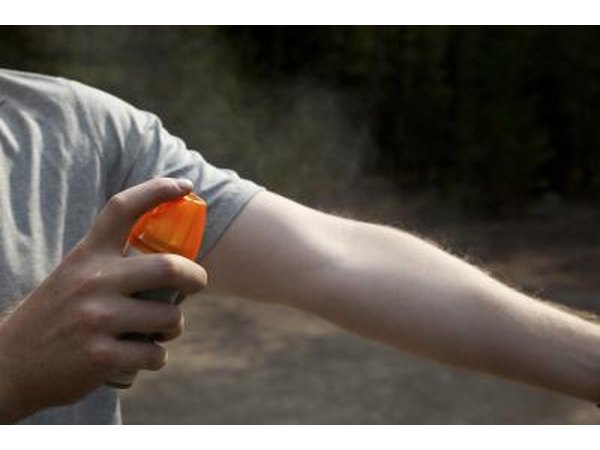 Insect repellent sprayed on arm