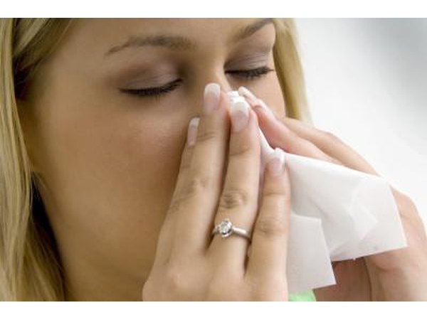woman blowing her nose