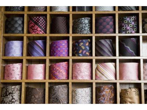 Assorted fabric on shelves.