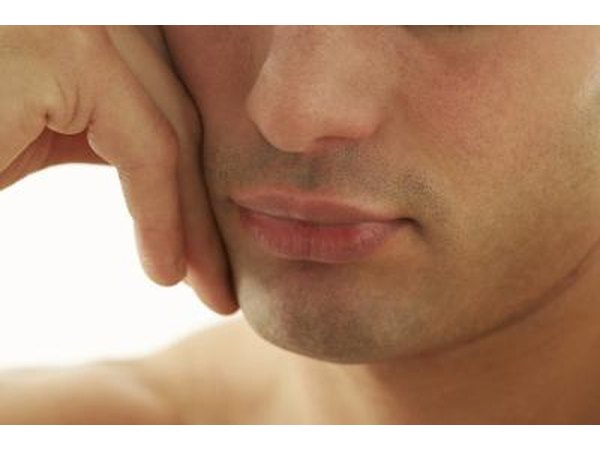 man touching chin