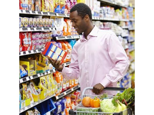 A man reading a nutritional label