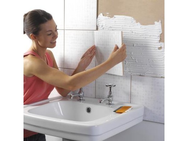 Woman renovating bathroom