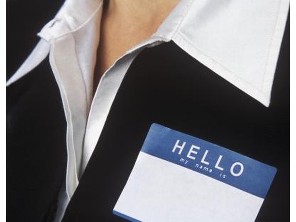 A woman has a blank name tag on her blazer.