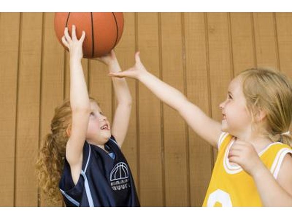 Little girls passing basketball