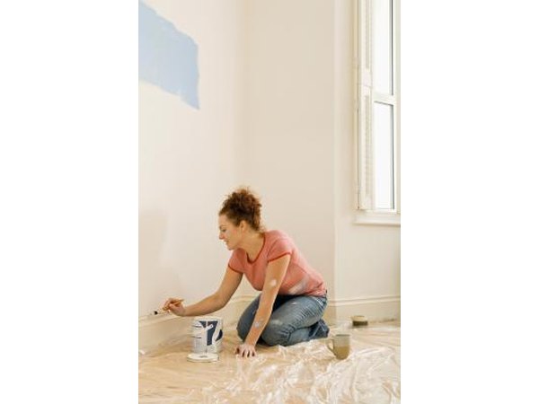 Paint the wall space between moldings to create the illusion of a taller baseboard.