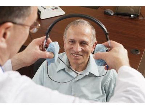 A hearing test is given to patients by the use of a headset.