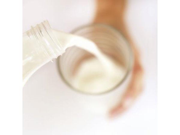 Milk pouring into a glass