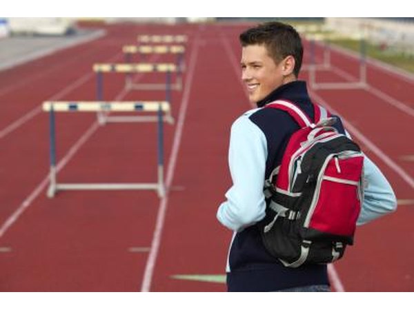 Teenage boy on track with backpack
