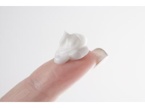 topical medication on woman's finger