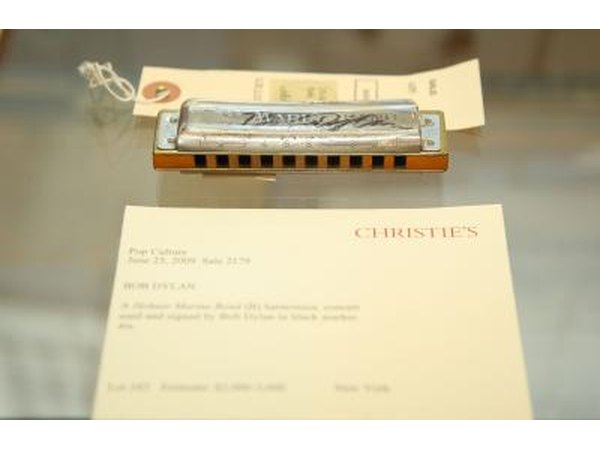 Bob Dylan's harmonica on display at an auction.