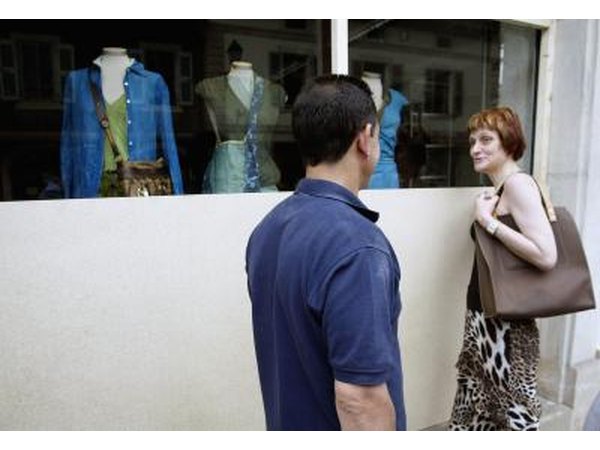 Couple looking at shop window in Geneva, Switzerland