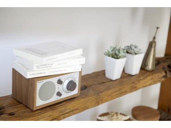 Rustic wooden shelves against a white wall.