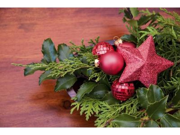 Use Christmas ornaments in your holiday centerpiece or create a tiny Christmas tree to commemorate the season.
