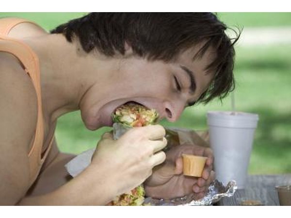 Man chewing sandwich
