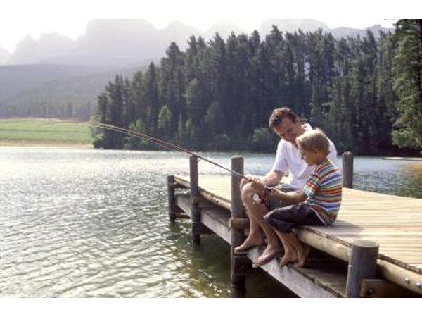 Boy fishing with his dad