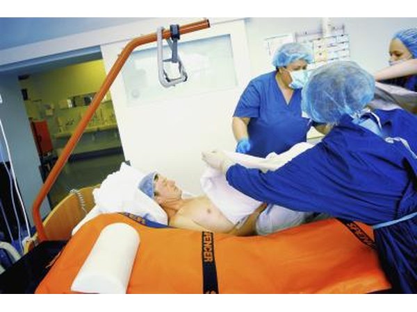 Transporters moving patient into new room