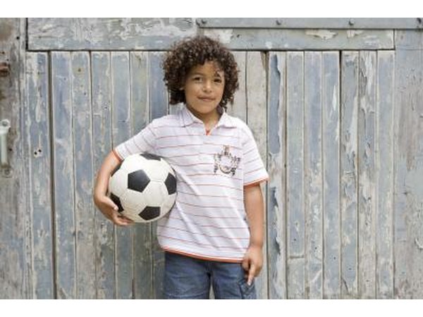 young boy with soccer ball