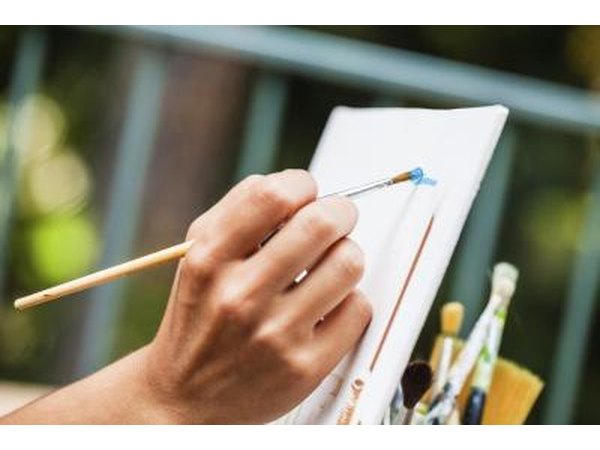 Close-up of hand holding paintbrush