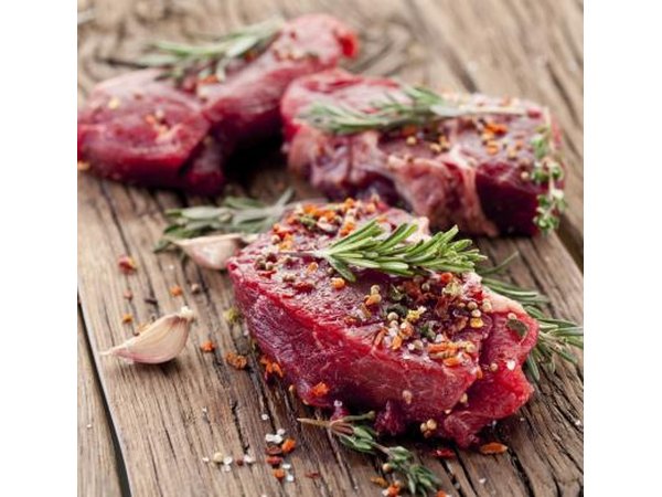Raw steak with seasoning