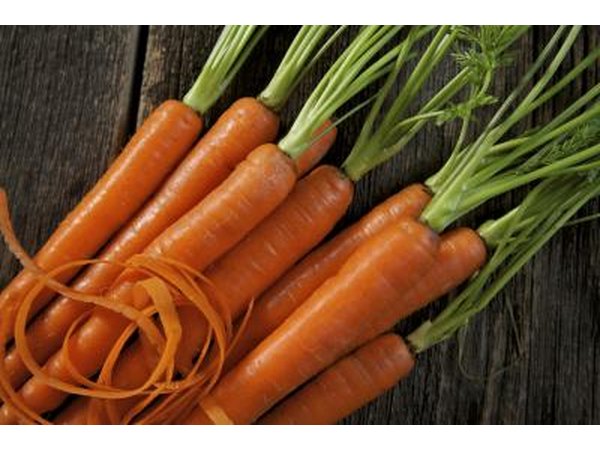 Fresh carrots on a rustic table