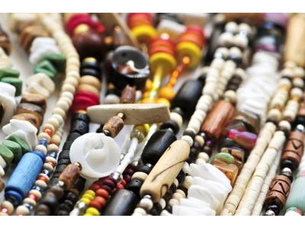 African people also make beads out of natural materials like bone, hell, wood, amber and glass.