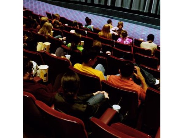 Young people sitting in movie theater