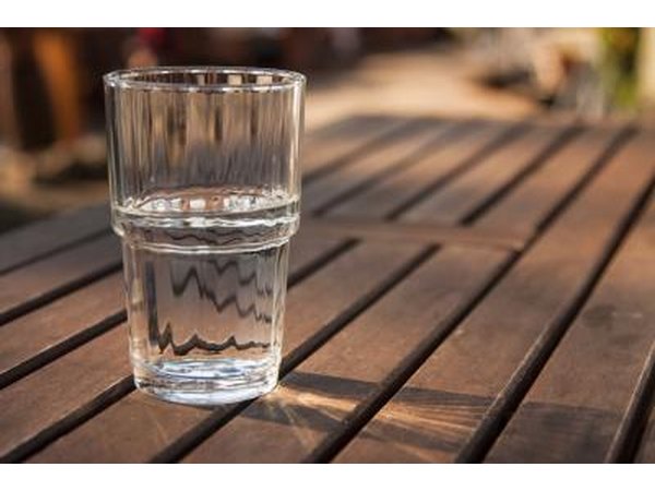 Glass of water on wood table