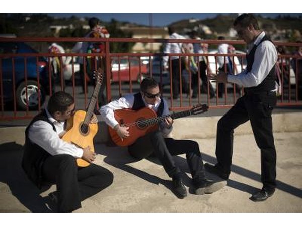 Men playing flamenco guitars in Spain.
