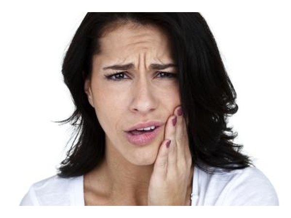 Woman with pain in her mouth.