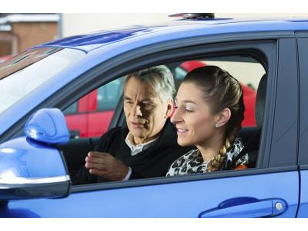 Driving instructor with student