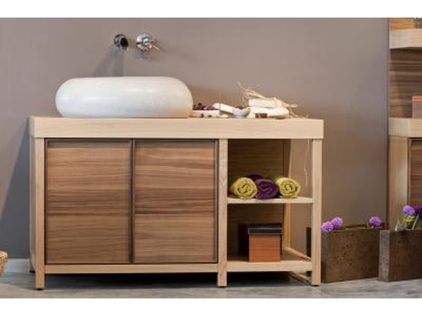 A modern bathroom vanity against an earth toned accent wall.