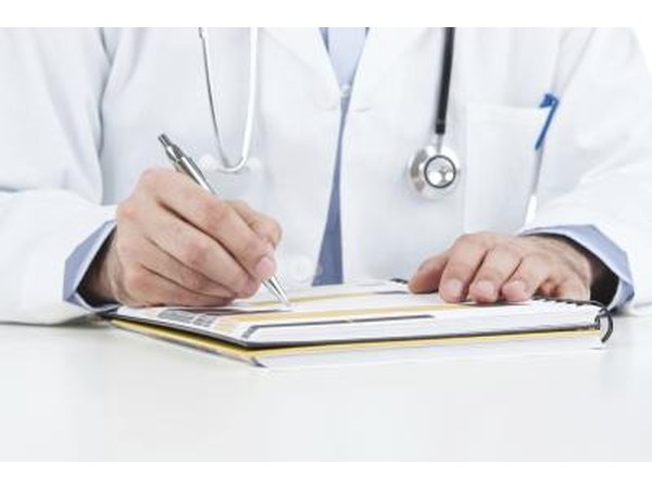A doctor writing a prescription