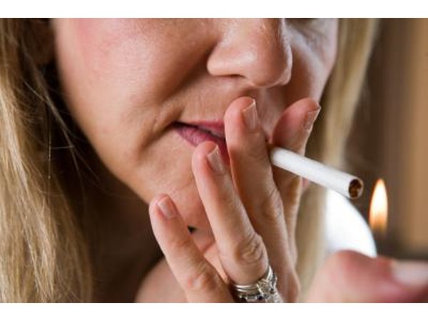 Woman lighting cigarette