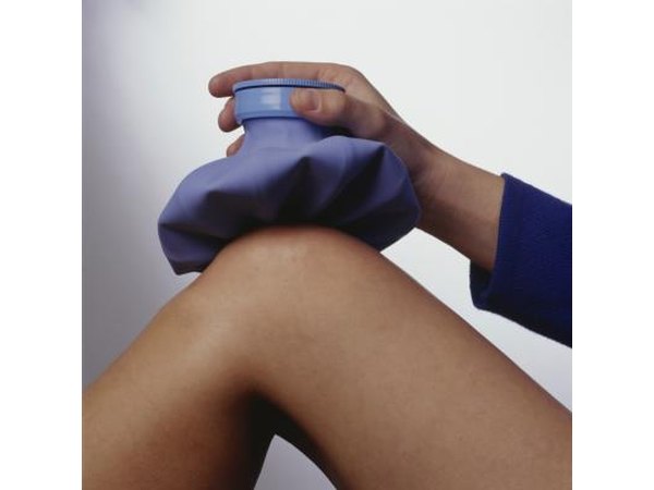 Applying ice pack to leg.
