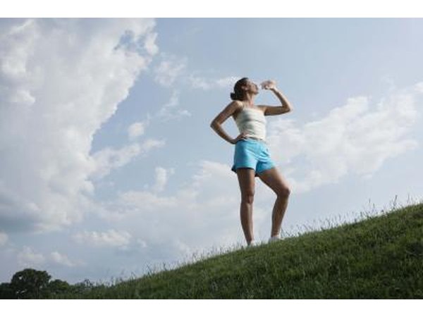 Woman drinking from water bottle