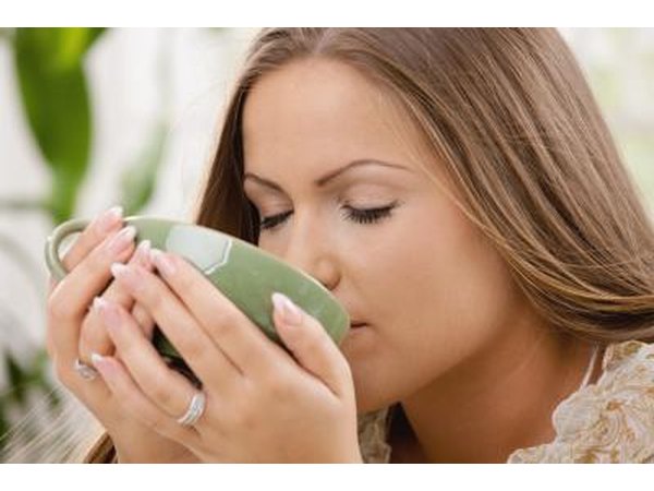 woman drinking hot lemon water