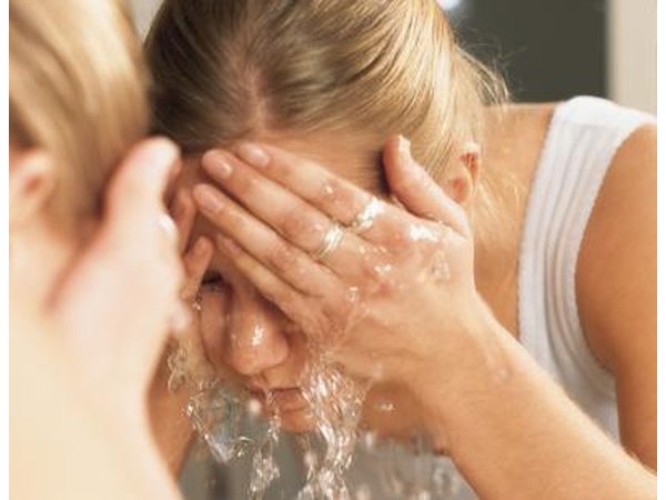 Rinsing eyes with warm water