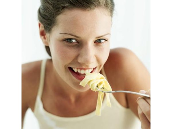 Woman eating pasta