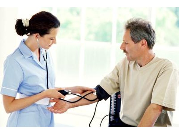 Patient having blood pressure tested by a nurse.