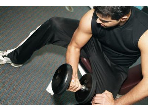 Man exercising with dumbbells in the gym