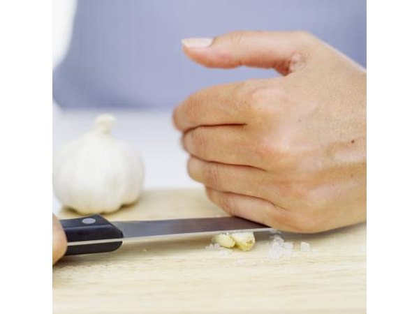 Put chopped up, grated or ground garlic into your food.