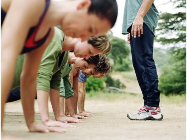 Exercise class performing push-ups