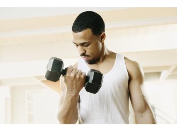 A man does a set of bicep curl.